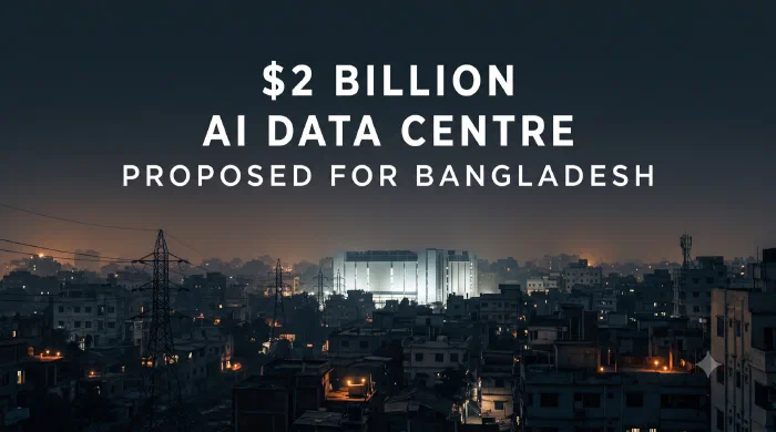 A brightly lit data centre building standing in the middle of a darkened city at dusk, with transmission towers in the foreground